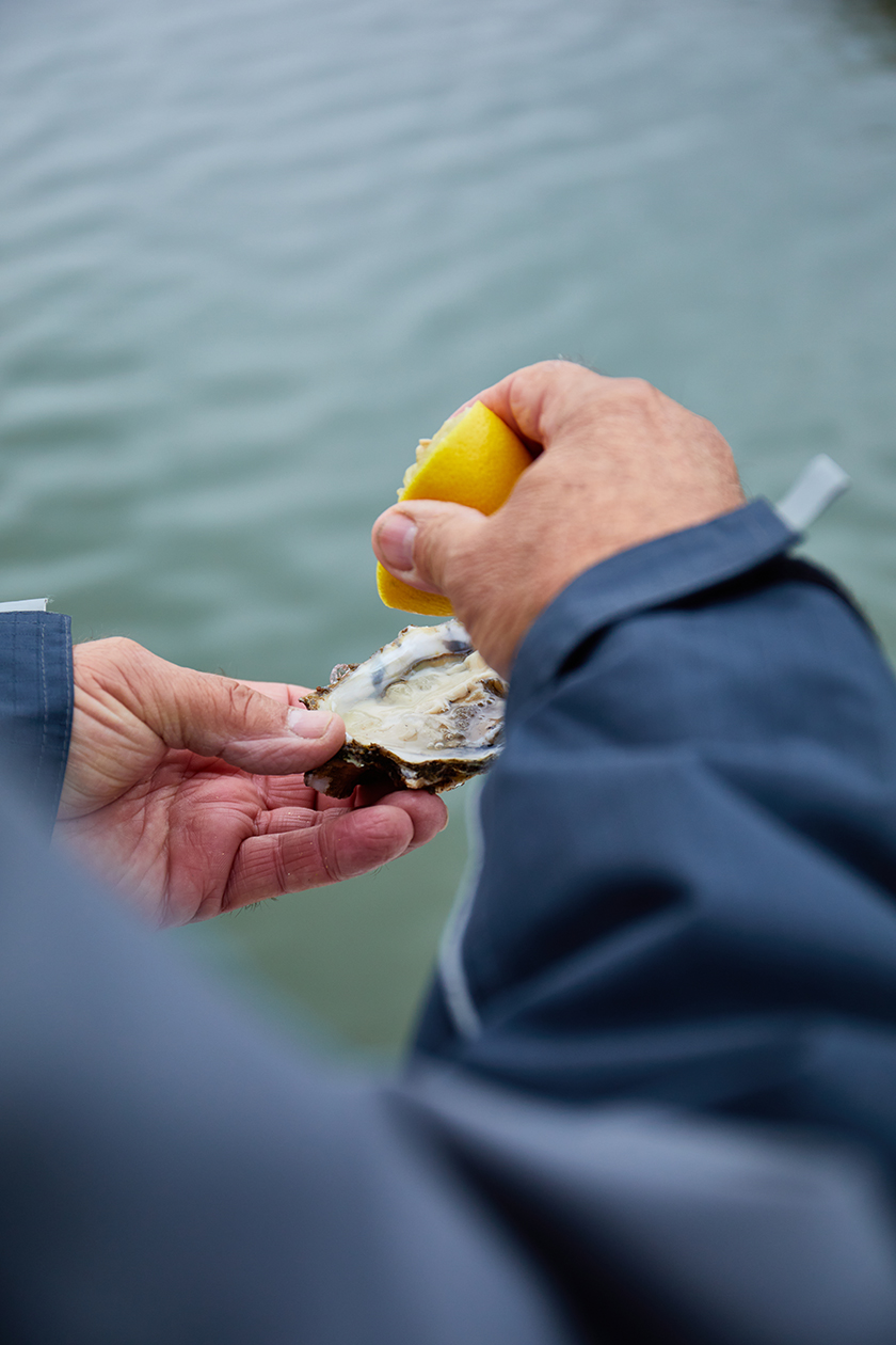 Fisherman about to eat an oyster
