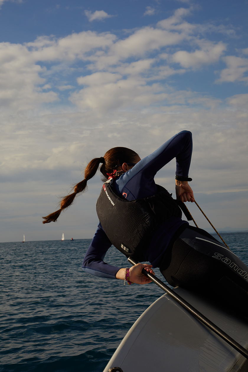 Girl practising sailing on the coast of Vilanova, Catalonia.
