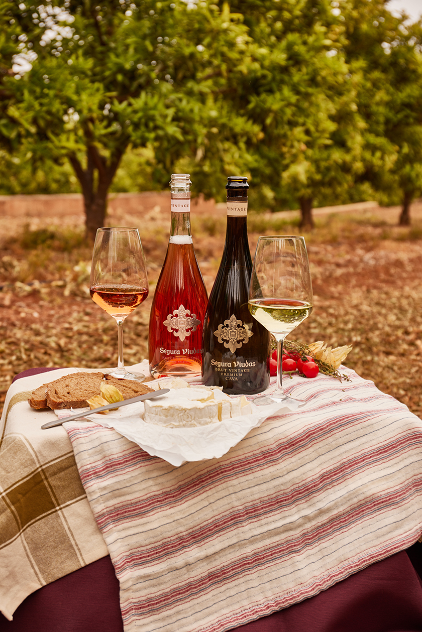 Two bottles of Segura Viudas cava in Vicky Sevilla's orchard.