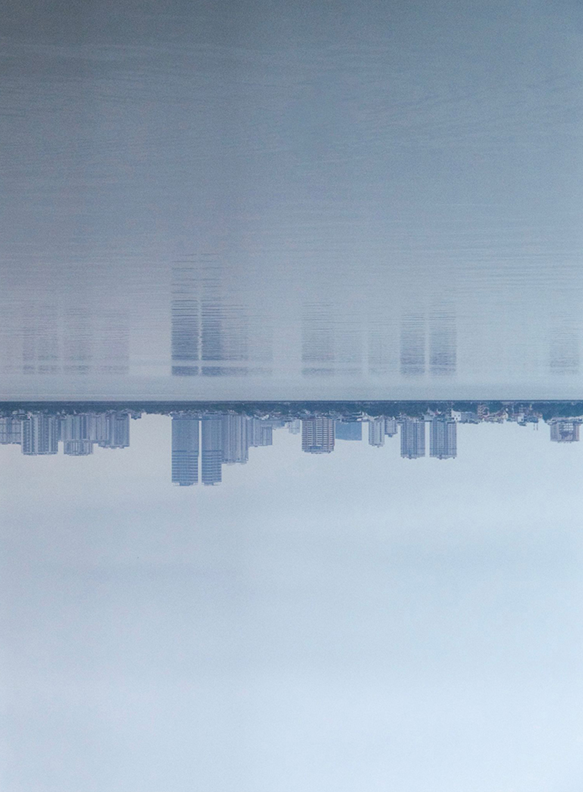 Reflection of buildings in a lake in Hanoi city.