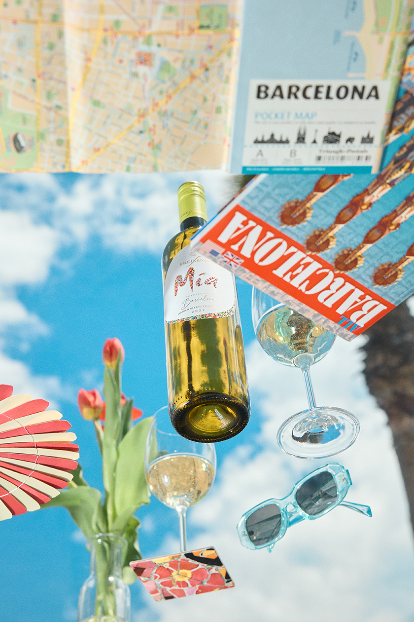 Image of a table full of food with a bottle of Freixenet's Mía brand wine.