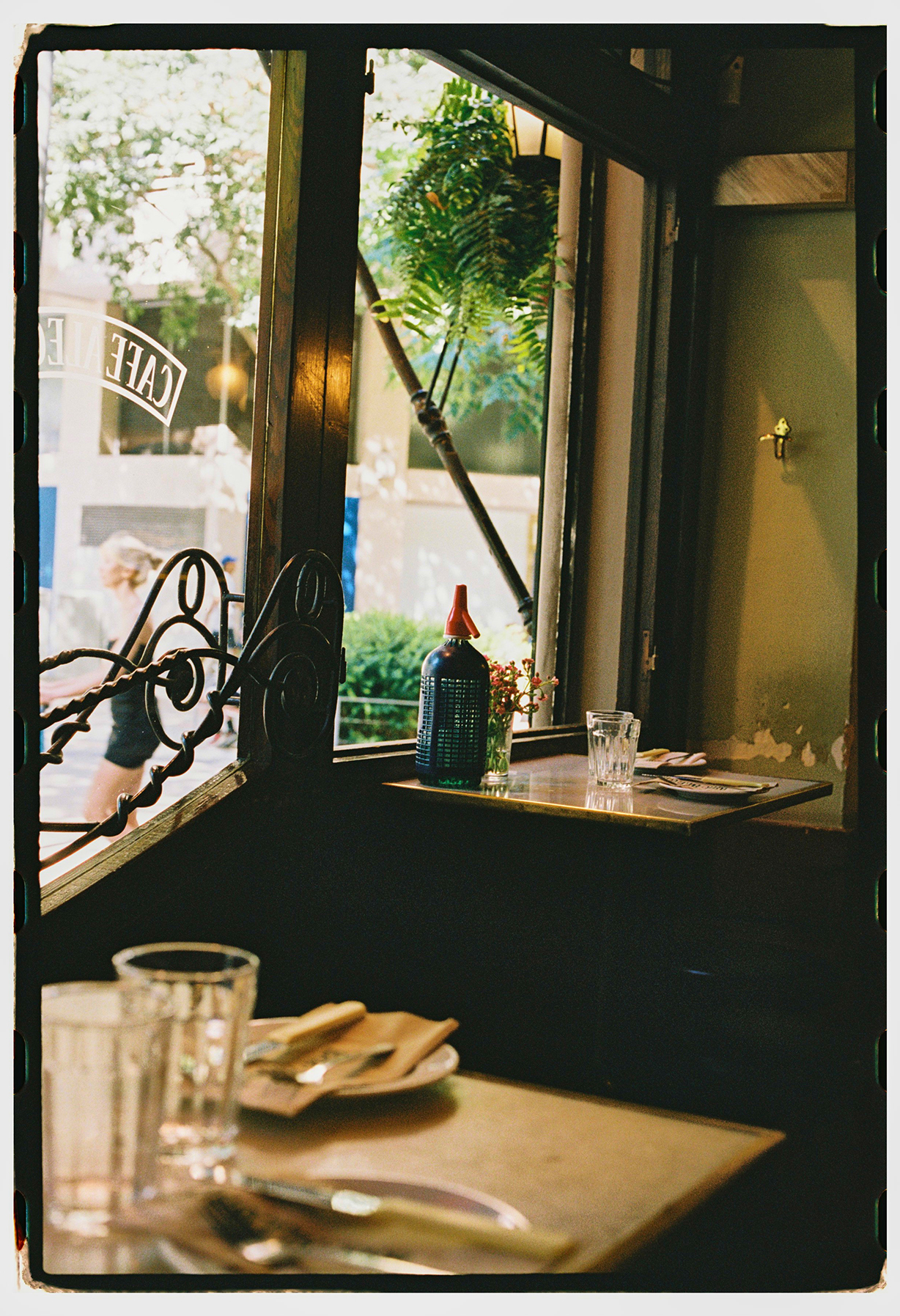 Image from inside the bar showing views of the streets of Barcelona by Beatriz Janer. 